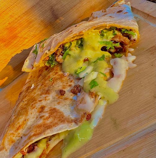 Quesadilla with seasoned meat and melted cheese at Too Good Papi Taqueria — Mexican food near me in Humble TX, open daily 8am to 11:30pm